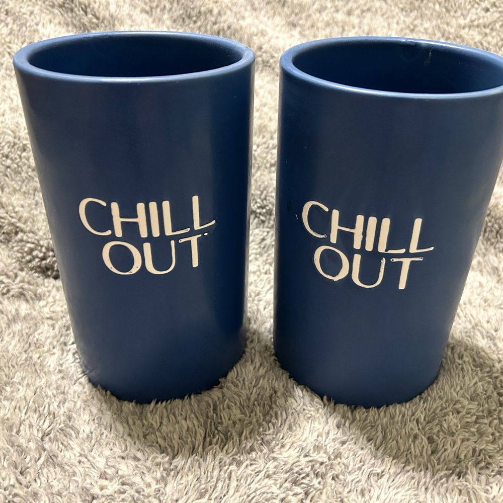 Wine bottle holder. Ceramic blue with white lettering “chill out”